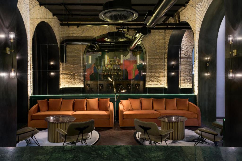 Hotel common room with modern work on the walls and a long counter