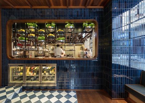 Hotel lobby fitted in green paint, metal and ribbed glass