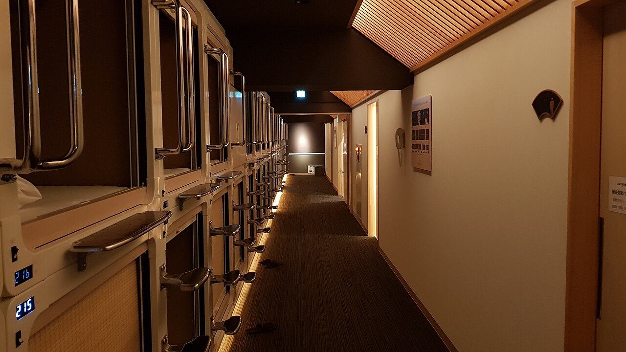 Narrow interior corridor lined with stacked compact sleeping berths